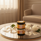 Brazilian Keratin Hair Cream jar on mirrored vanity tray with pearls and soft white flowers in golden light
